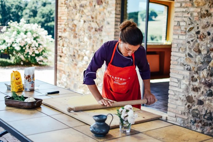 Italian chef rolling out pasta