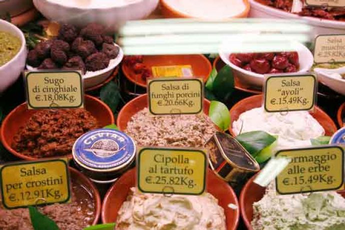 Stall of local Tuscan produce on food market in Florence.