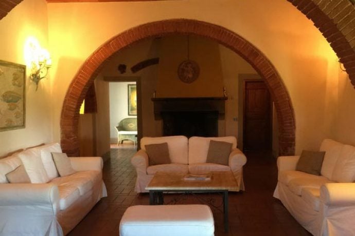Cozy lounge in rustic Tuscan holiday villa.