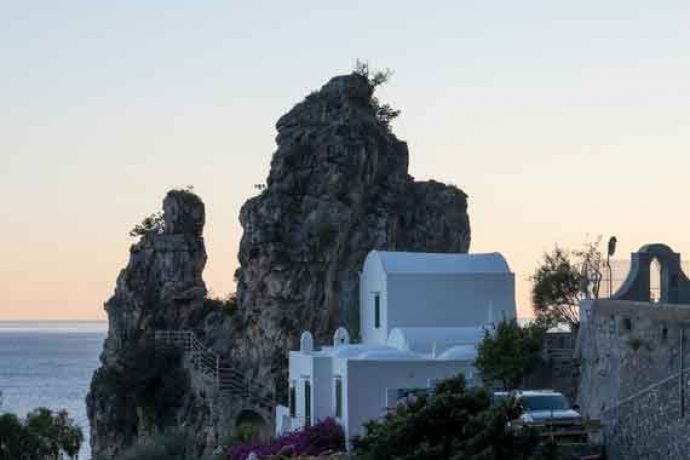 White house and romantic sunset in the in the Amalfi coast.