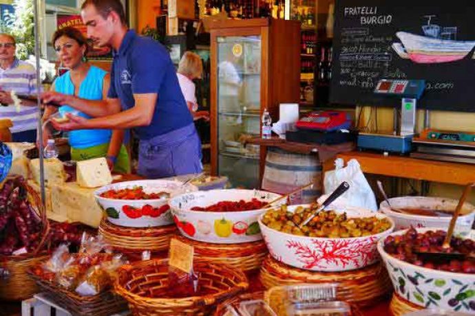 Stall of fresh vegetables in a food market in Syracuse.