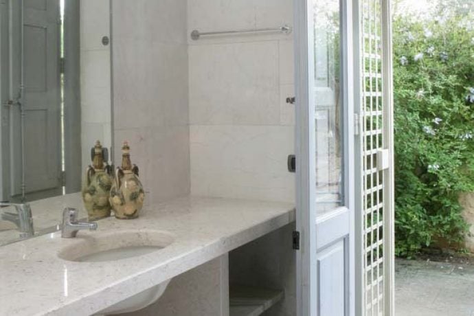 Sink in bathroom with access to garden