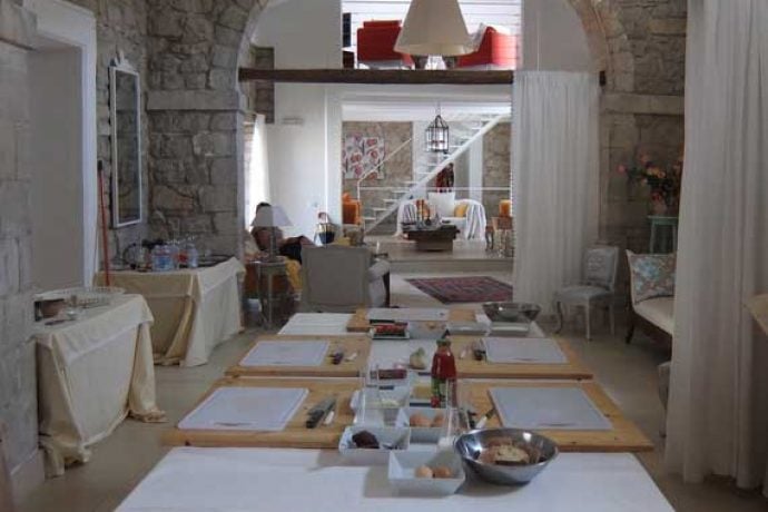Table set for group to start their cookery lesson