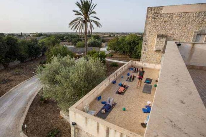 Pilates seshion on the holiday venue's terrace in the Sicilian sunshine.