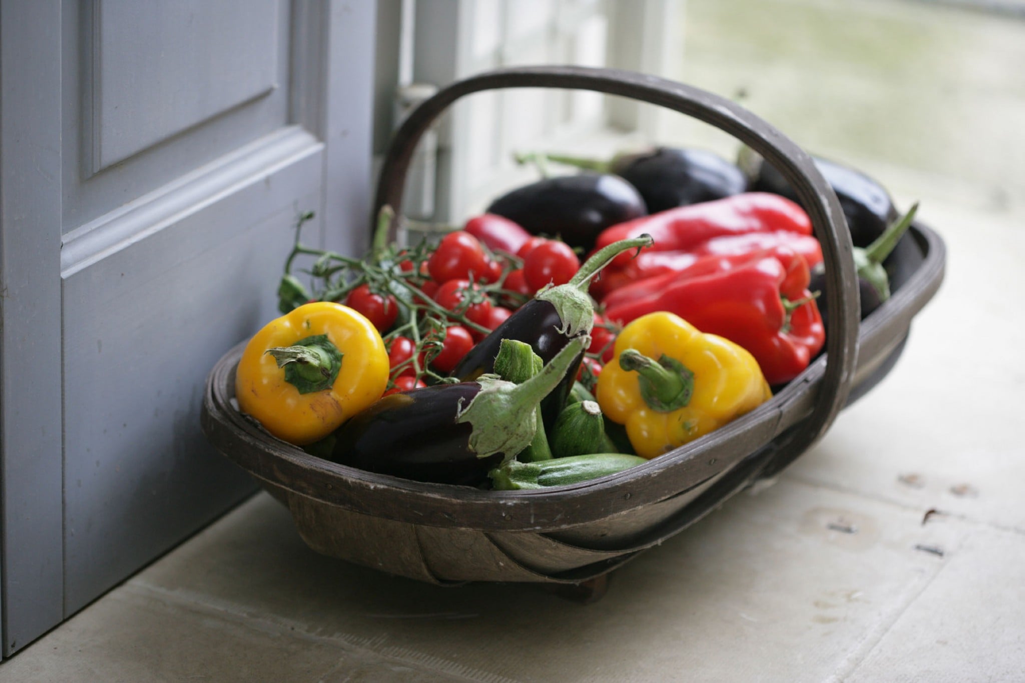 A delicious looking basket full of fresh Italian vegetables