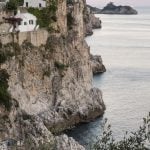 The stunning Amalfi coast at sun sets at the horizon