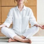 Mature woman meditating in the lotus positio