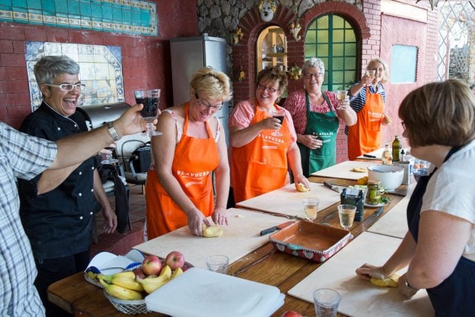 cooking and laughing in an Italian cooking holiday