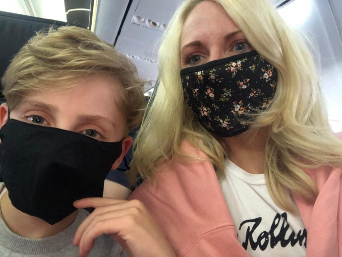 Julie wearing face mask on plane