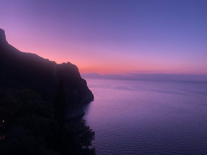 View of the Amalfi Coast as the sun rises over the sea